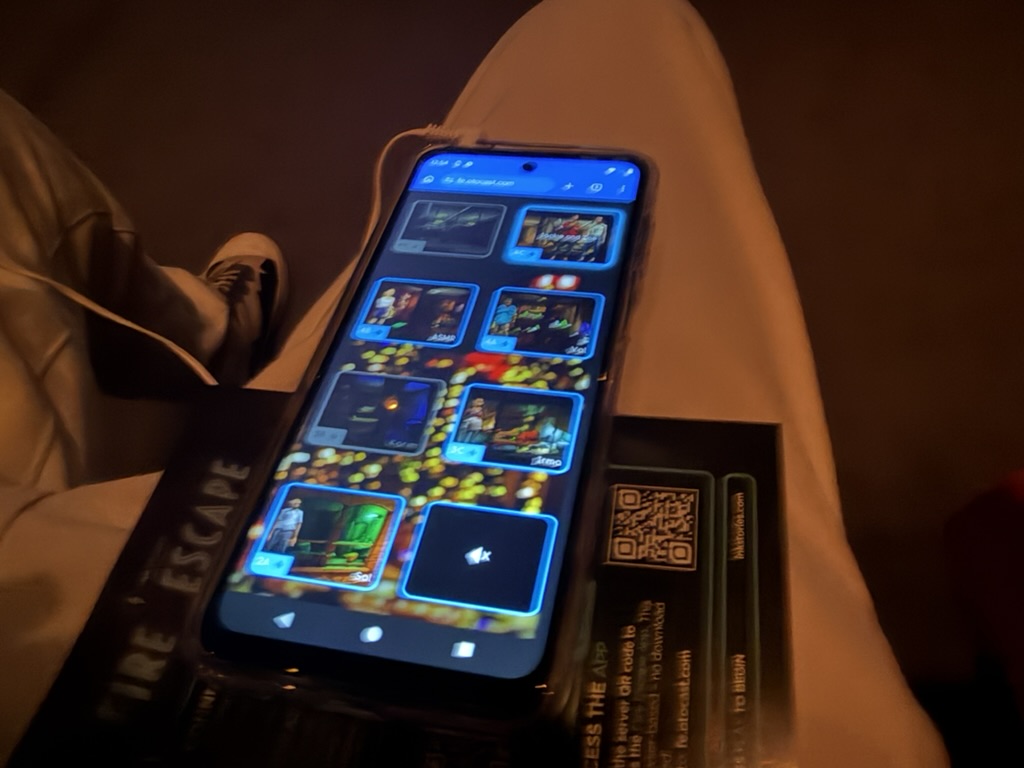 Blurry cell phone photo of the web app used to change the audio to listen in on